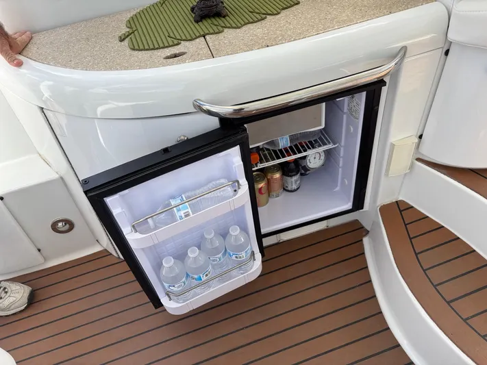 Cookin' Yacht Photos Pics Mini fridge on 2008 Formula 37 PC yacht, stocked with drinks, open on deck.