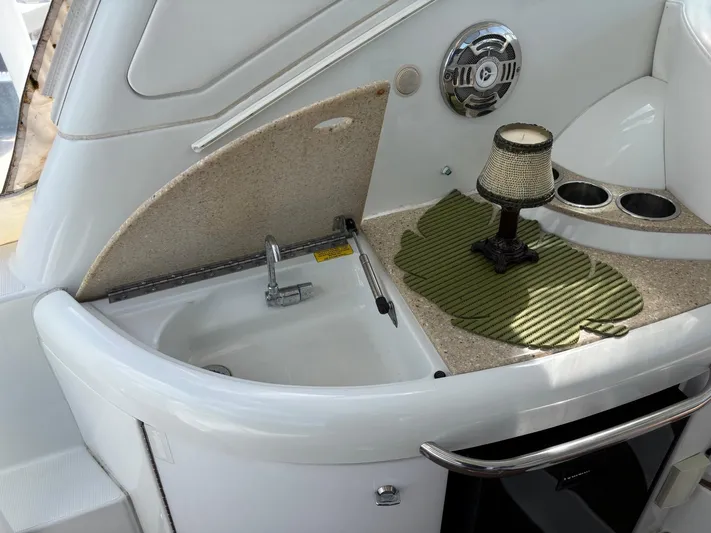 Cookin' Yacht Photos Pics 2008 Formula 37 PC yacht interior with sink, countertop, and decorative lamp.