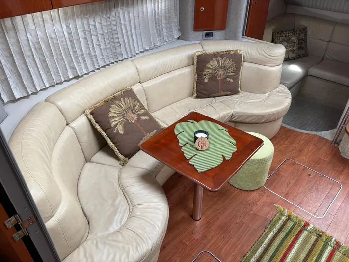 Cookin' Yacht Photos Pics Luxurious interior of 2008 Formula 37 PC yacht with beige seating and decorative pillows.