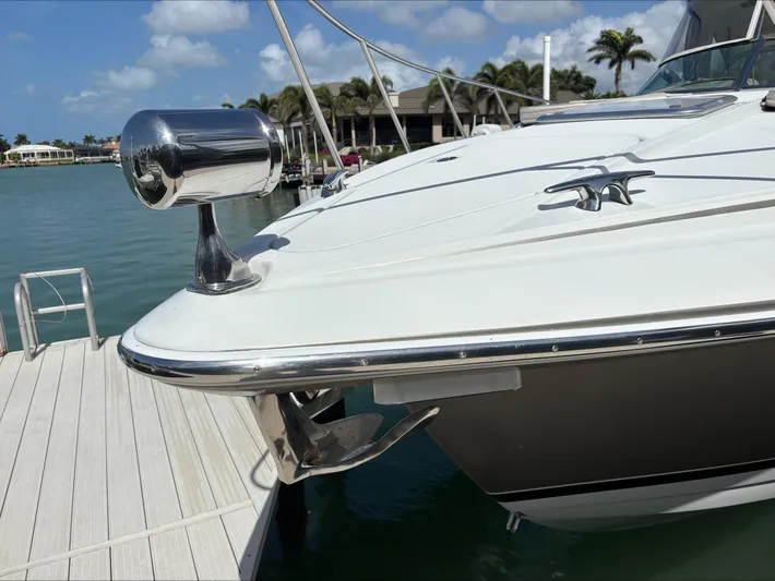 Cookin' Yacht Photos Pics 2008 Formula 37 PC yacht docked, showcasing sleek bow design and chrome details.