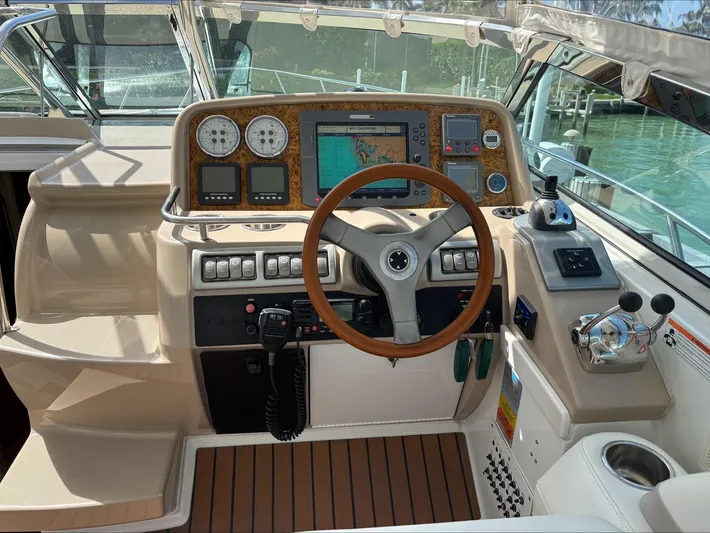 Cookin' Yacht Photos Pics 2008 Formula 37 PC yacht helm with navigation controls and wooden steering wheel.