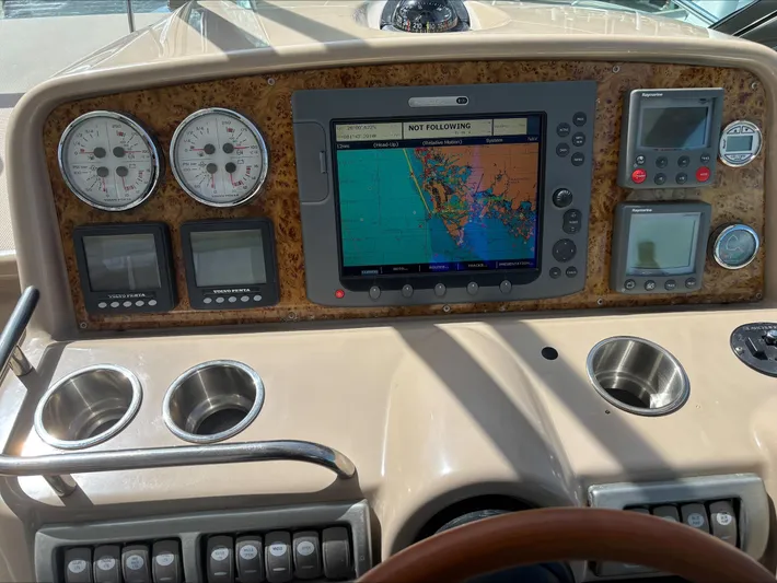 Cookin' Yacht Photos Pics Dashboard of a 2008 Formula 37 PC boat with navigation system and gauges.