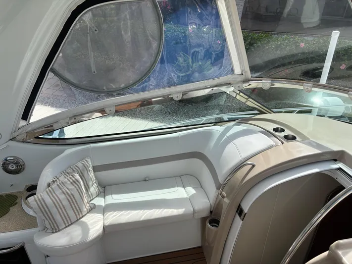 Cookin' Yacht Photos Pics 2008 Formula 37 PC yacht interior with white seating and striped pillow.