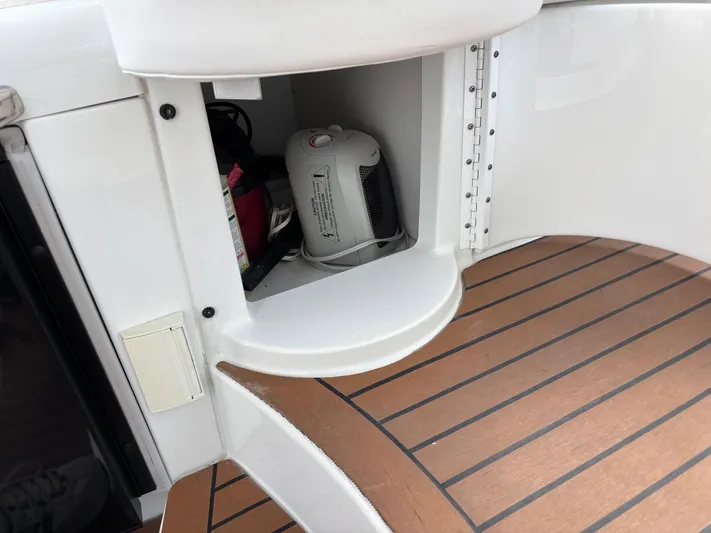 Cookin' Yacht Photos Pics 2008 Formula 37 PC boat interior with open storage compartment and wooden flooring.
