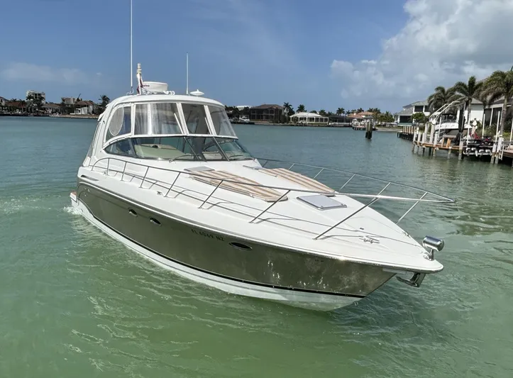 Cookin' Yacht Photos Pics 2008 Formula 37 PC yacht cruising in a serene coastal waterway.