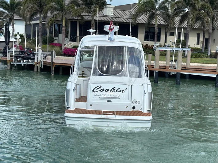 Cookin' Yacht Photos Pics 2008 Formula 37 PC boat docked near palm trees in Marco Island, FL.