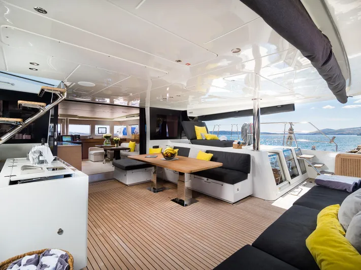 Duolife Yacht Photos Pics Luxurious 2019 Lagoon 620 Essence yacht interior with elegant seating and ocean view.