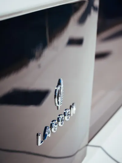 Duolife Yacht Photos Pics Close-up of 2019 Lagoon 620 Essence yacht logo on sleek hull.