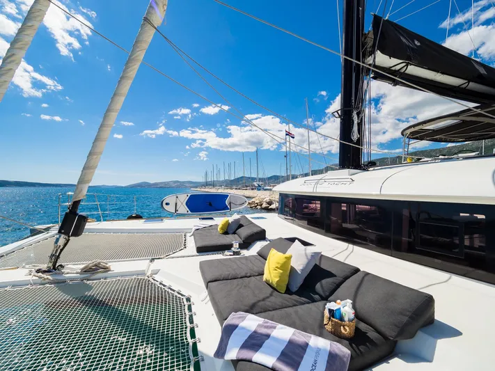 Duolife Yacht Photos Pics Luxurious 2019 Lagoon 620 Essence catamaran with sunbathing area and stunning ocean view.