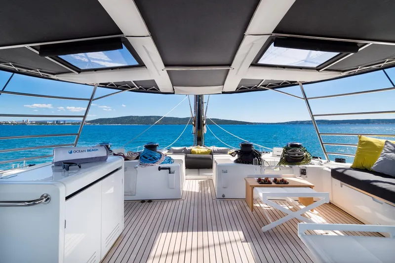 Duolife Yacht Photos Pics Luxurious 2019 Lagoon 620 Essence yacht deck with ocean view and comfortable seating.