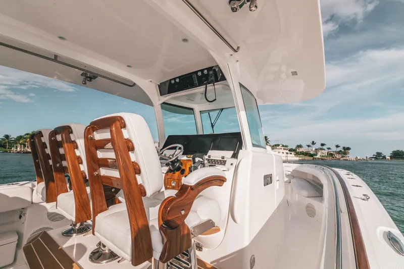  Yacht Photos Pics 2021 HCB 42 Lujo boat interior with luxurious seating and helm, ocean view.