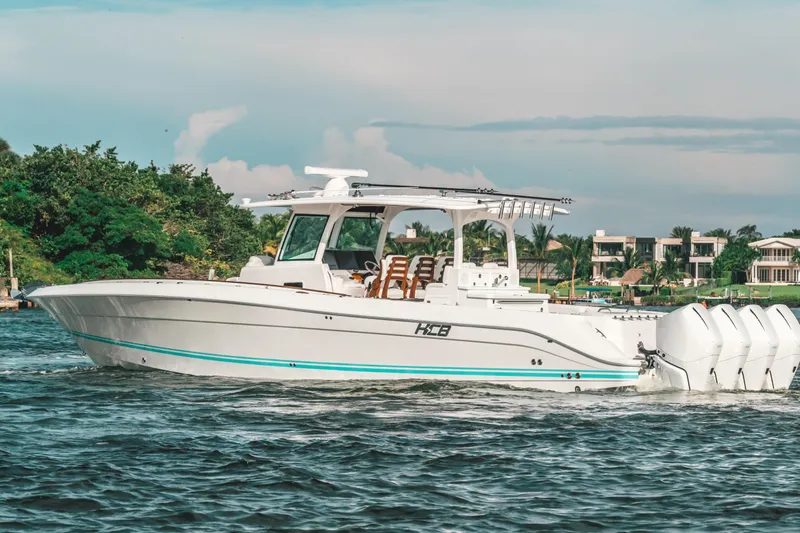  Yacht Photos Pics 2021 HCB 42 Lujo boat cruising on a scenic waterway.