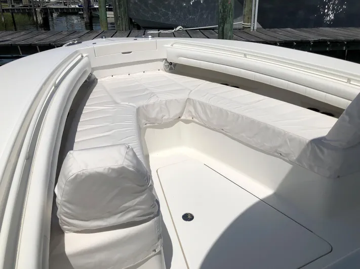  Yacht Photos Pics 2018 Regulator 28 Center Console boat with white cushioned seating area.