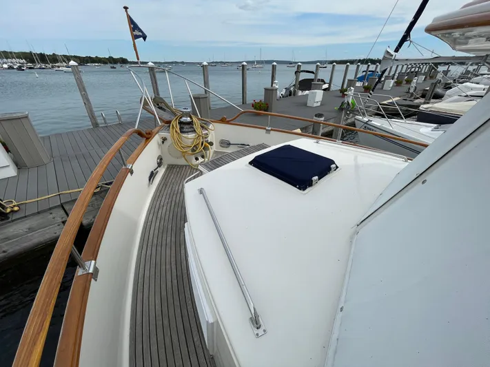 Meritage Yacht Photos Pics 1990 Grand Banks 42 Classic yacht docked at marina, showcasing deck and railing.