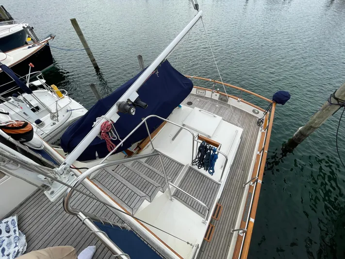 Meritage Yacht Photos Pics 1990 Grand Banks 42 Classic yacht docked, featuring a spacious deck and nautical equipment.