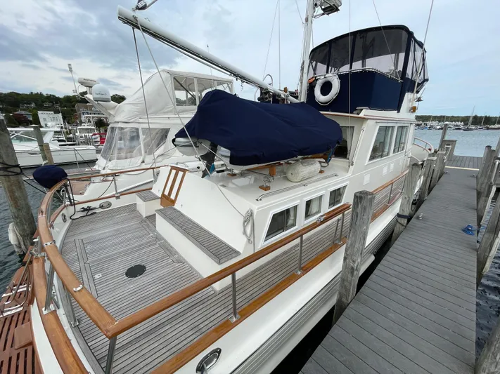 Meritage Yacht Photos Pics 1990 Grand Banks 42 Classic yacht docked, showcasing elegant wooden deck and nautical features.