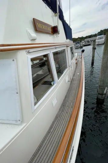 Meritage Yacht Photos Pics 1990 Grand Banks 42 Classic yacht docked, showcasing elegant wooden deck and sleek design.