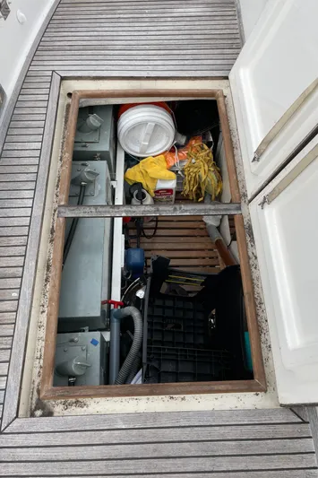 Meritage Yacht Photos Pics Open hatch on 1990 Grand Banks 42 Classic, revealing storage and equipment.