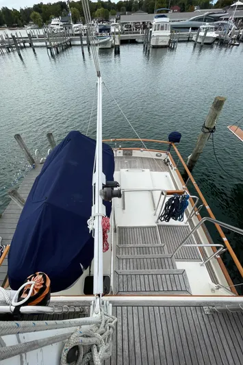 Meritage Yacht Photos Pics Grand Banks 42 Classic yacht docked at marina, showcasing deck and mooring lines.