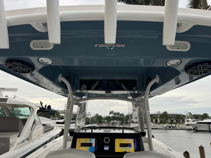 Re-powered-2022 Yacht Photos Pics 2019 Fountain 38 CC boat interior with navigation screens and overhead canopy.