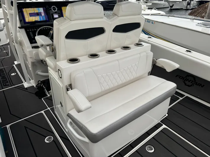 Re-powered-2022 Yacht Photos Pics 2019 Fountain 38 CC boat interior with white seating and cup holders.