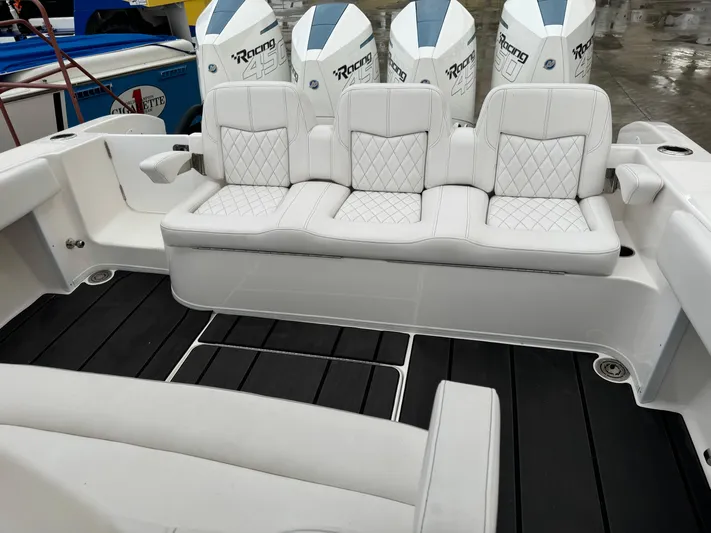 Re-powered-2022 Yacht Photos Pics 2019 Fountain 38 CC boat with white seating and powerful engines.