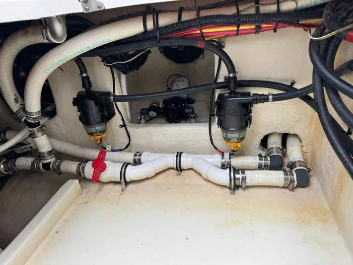 Re-powered-2022 Yacht Photos Pics 2019 Fountain 38 CC boat plumbing system with hoses and valves.