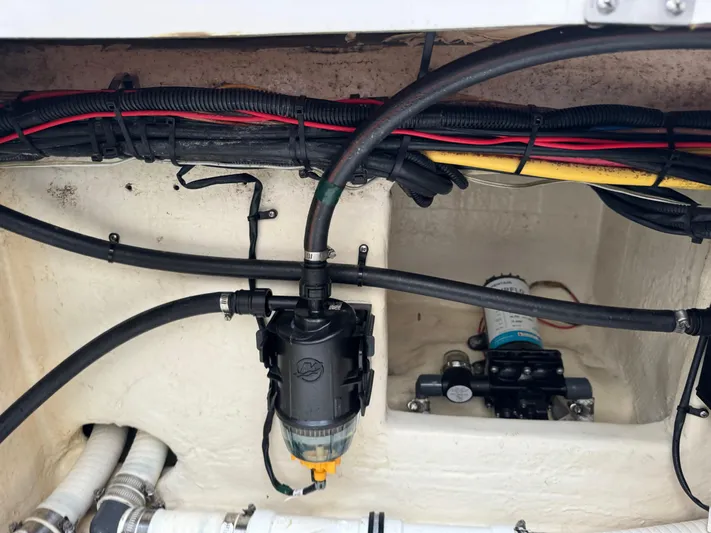 Re-powered-2022 Yacht Photos Pics 2019 Fountain 38 CC boat wiring and plumbing system close-up.