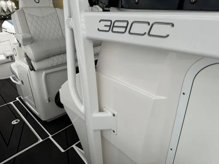 Re-powered-2022 Yacht Photos Pics 2019 Fountain 38 CC boat interior with white seating and sleek design.