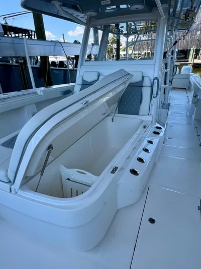  Yacht Photos Pics 2022 Invincible 46 Catamaran with open storage compartment on deck.
