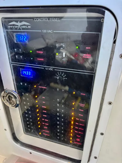  Yacht Photos Pics Control panel of 2022 Invincible 46 Catamaran displaying 120 VAC and 12 VDC systems.