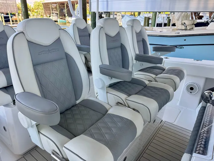  Yacht Photos Pics Luxurious seating on 2022 Invincible 46 Catamaran, featuring elegant gray and white upholstery.