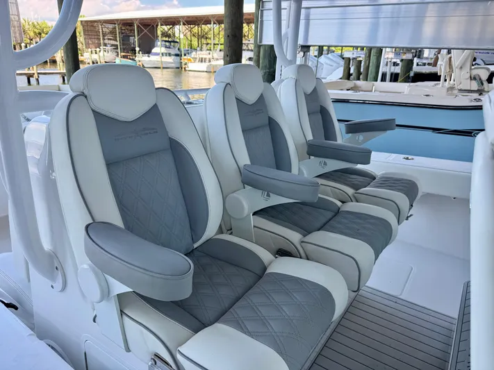  Yacht Photos Pics Luxurious seating on 2022 Invincible 46 Catamaran, featuring plush, ergonomic design.