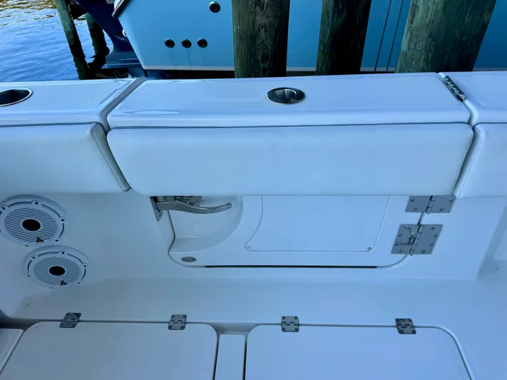  Yacht Photos Pics 2022 Invincible 46 Catamaran interior with white seating and storage compartments.