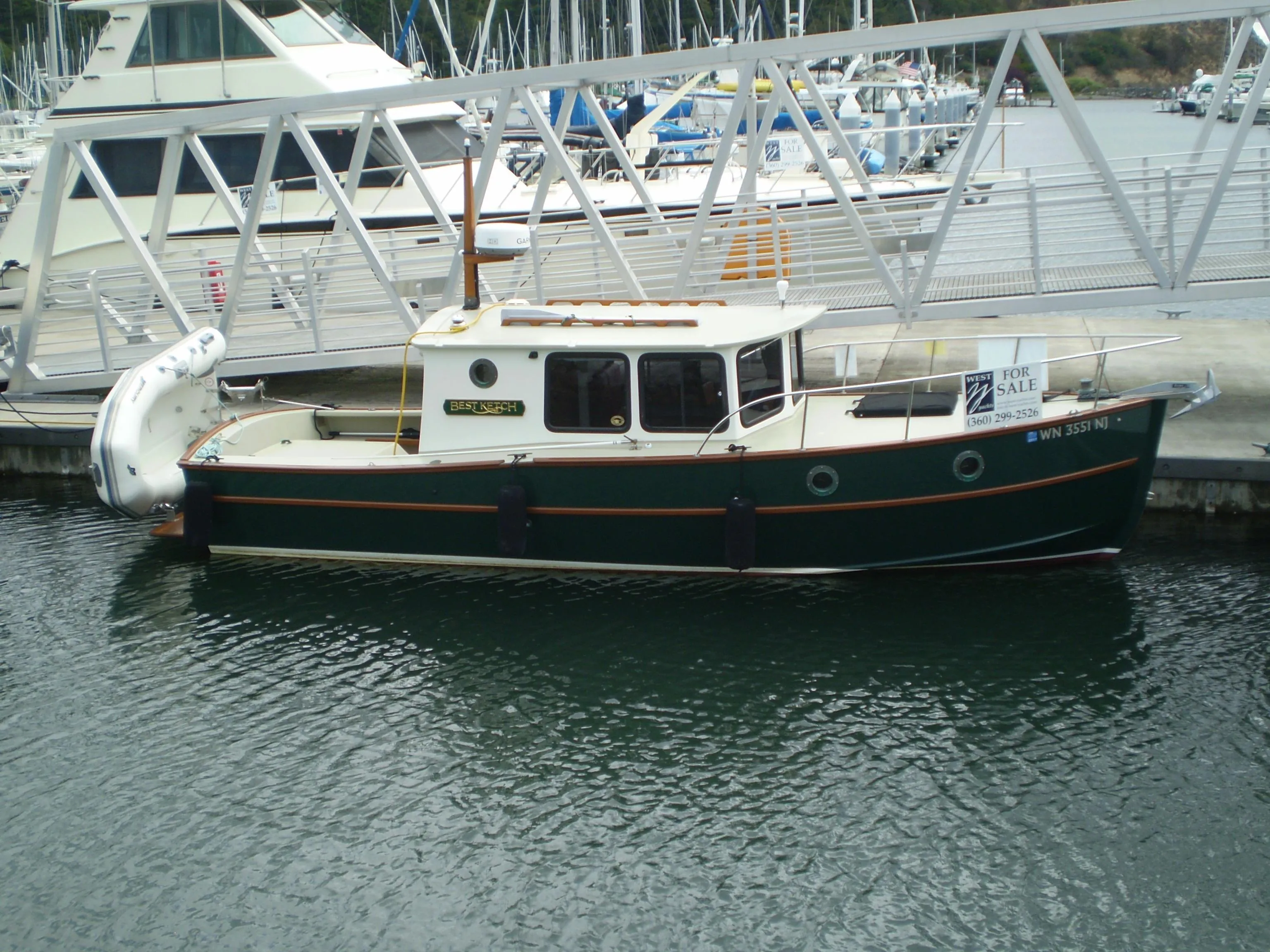 2000 Devlin Surf Scoter boat docked, for sale sign visible.