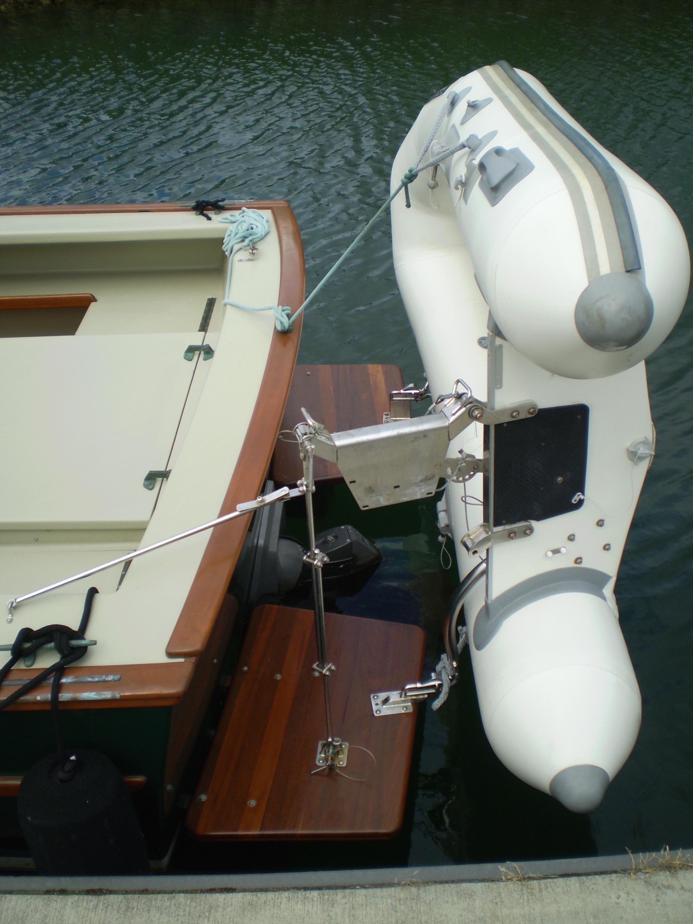Devlin Surf Scoter 2000 with attached inflatable dinghy on calm water.