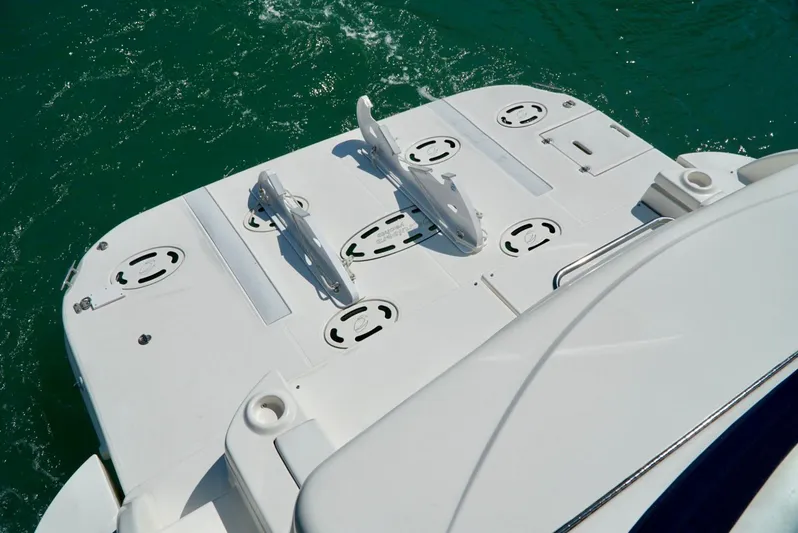 Kaizen Yacht Photos Pics 2007 Cruisers Yachts 560 Express swim platform on turquoise water.