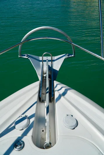 Kaizen Yacht Photos Pics Bow of 2007 Cruisers Yachts 560 Express on calm water.