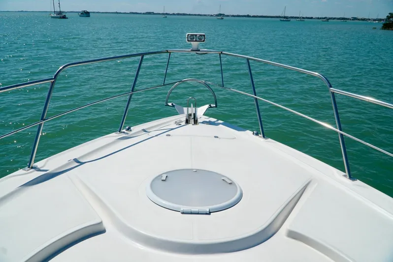 Kaizen Yacht Photos Pics Bow view of 2007 Cruisers Yachts 560 Express on calm waters.