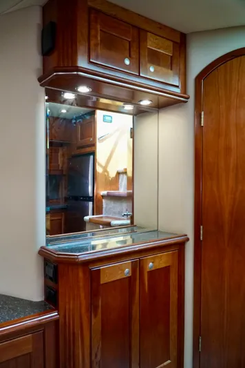 Kaizen Yacht Photos Pics Luxurious wooden cabinetry in the 2007 Cruisers Yachts 560 Express interior.
