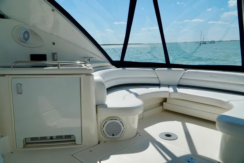 Kaizen Yacht Photos Pics 2007 Cruisers Yachts 560 Express interior with curved seating and ocean view.