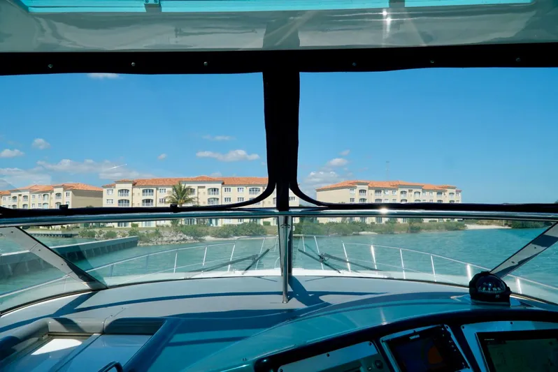 Kaizen Yacht Photos Pics View from the helm of a 2007 Cruisers Yachts 560 Express, approaching a marina.