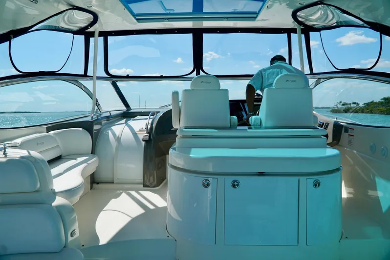 Kaizen Yacht Photos Pics Interior of 2007 Cruisers Yachts 560 Express with panoramic windows and luxurious seating.