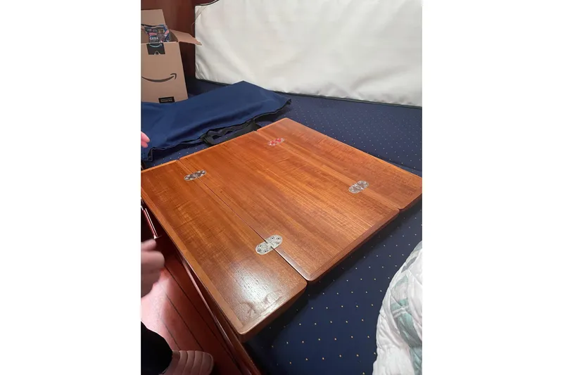 Gemini's Escape II Yacht Photos Pics Wooden table on Beneteau Oceanis 42CC sailboat, year 2005.