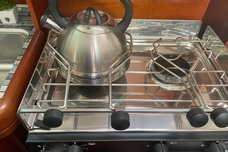 Gemini's Escape II Yacht Photos Pics Stainless steel kettle on stove in 2005 Beneteau Oceanis 42CC yacht kitchen.
