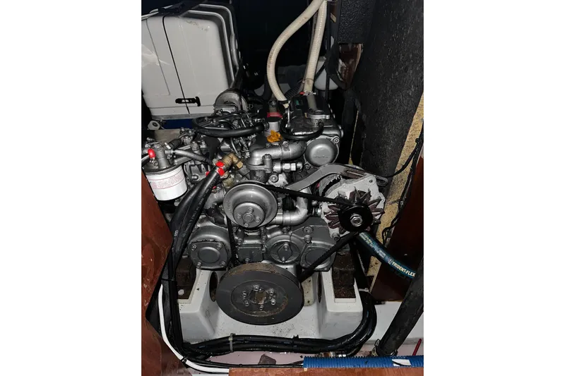 Gemini's Escape II Yacht Photos Pics Engine compartment of a 2005 Beneteau Oceanis 42CC sailboat, showcasing mechanical components.