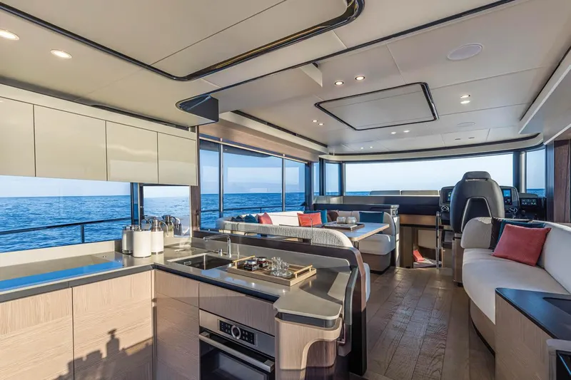  Yacht Photos Pics Luxurious interior of 2026 Absolute Navetta 53 yacht with ocean view.