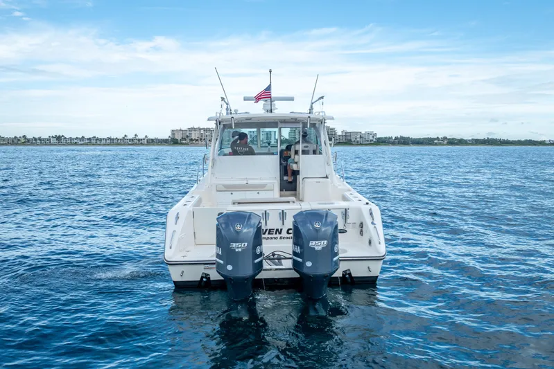"seven C's" Yacht Photos Pics 2011 Pursuit OS 345 Offshore boat on open water with twin Yamaha engines.