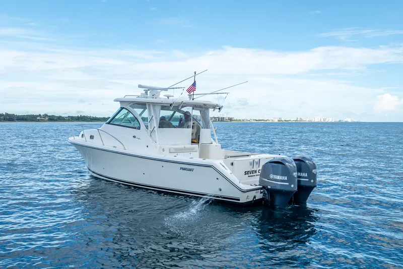 "seven C's" Yacht Photos Pics 2011 Pursuit OS 345 Offshore boat cruising on open water with twin Yamaha engines.