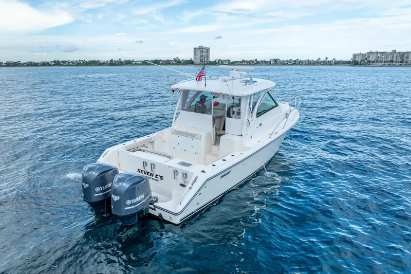 "seven C's" Yacht Photos Pics 2011 Pursuit OS 345 Offshore boat on open water with twin Yamaha engines.